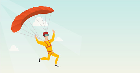 Image showing Young caucasian skydiver flying with a parachute.