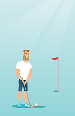 Image showing Young caucasian golfer hitting a ball.