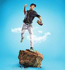 Image showing The one caucasian man as baseball player playing against blue sky