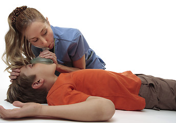 Image showing Resuscitating unconscious boy