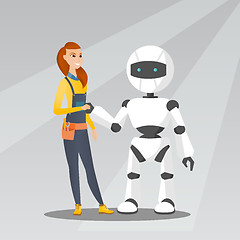 Image showing Young caucasian woman handshaking with robot.