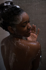 Image showing African American woman in the shower