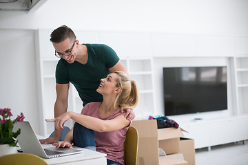 Image showing Young couple moving in a new home