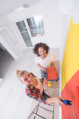 Image showing couple painting interior wall