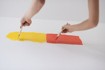 Image showing couple painting interior wall