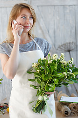 Image showing Florist girl talking on phone