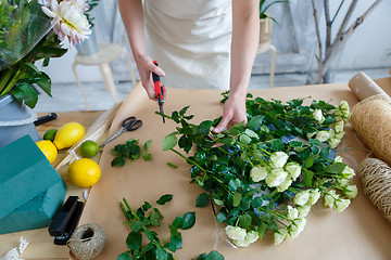 Image showing Photo of florist with flowers