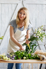 Image showing Florist blonde in flower shop