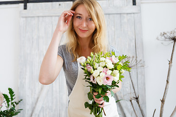 Image showing Portrait of woman with bouquet