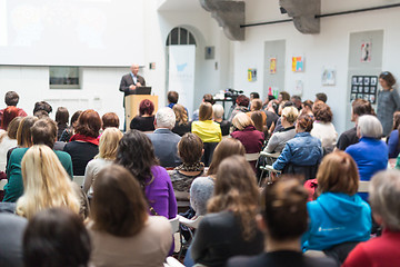 Image showing Man giving presentation in lecture hall at university.