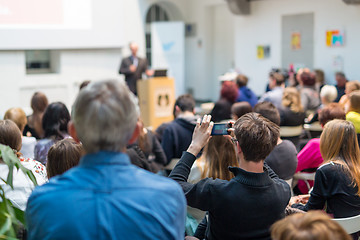 Image showing Man giving presentation in lecture hall at university.