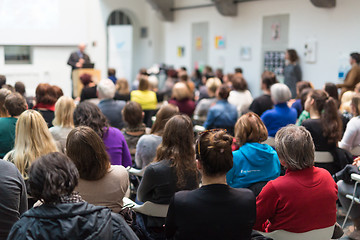 Image showing Man giving presentation in lecture hall at university.