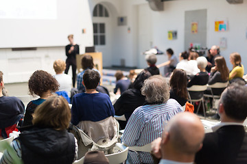 Image showing Woman giving presentation in lecture hall at university.