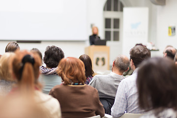 Image showing Woman giving presentation in lecture hall at university.