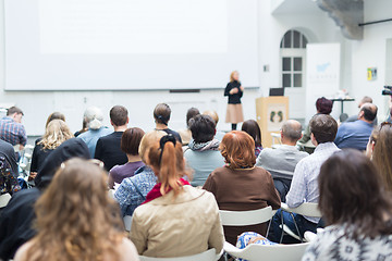 Image showing Woman giving presentation in lecture hall at university.