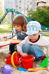 Image showing Two kids in a sandbox