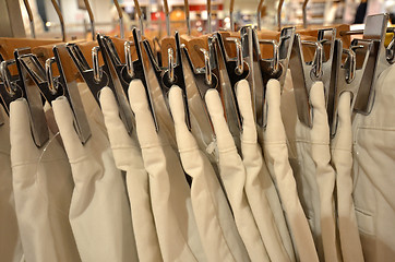 Image showing Designer clothes hanger in a row 