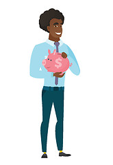 Image showing Caucasian business man holding a piggy bank.