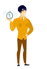 Image showing Asian business man holding alarm clock.