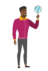 Image showing African-american business man holding hand mirror.