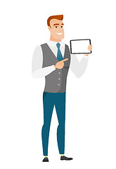 Image showing Smiling businessman holding tablet computer.