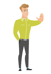 Image showing Caucasian businessman showing stop hand gesture.