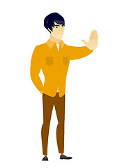 Image showing Asian businessman showing stop hand gesture.