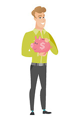 Image showing Caucasian business man holding a piggy bank.