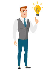 Image showing Businessman pointing at business idea light bulb.
