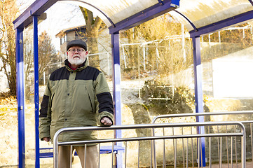 Image showing Male senior is waiting on Bus Stop