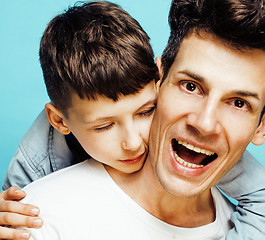 Image showing young pretty man model with little cute son playing together, lifestyle modern people concept, family male 