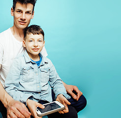 Image showing young pretty man model with little cute son playing together, lifestyle modern people concept, family male 