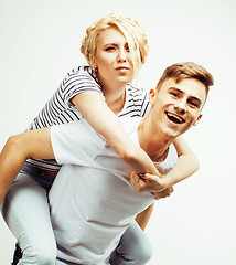 Image showing couple of happy smiling teenagers students, warm colors having a kiss, lifestyle people concept, boy and girl together