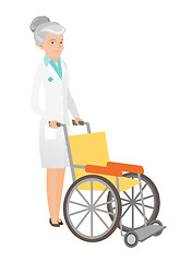 Image showing Senior caucasian doctor pushing wheelchair.