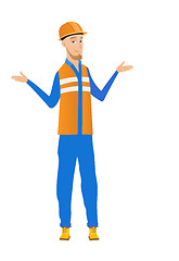 Image showing Confused young caucasian builder with spread arms