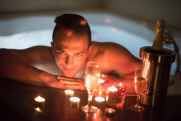 Image showing man relaxing in the jacuzzi