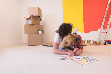 Image showing Happy young couple relaxing after painting