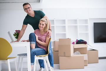 Image showing Young couple moving in a new home