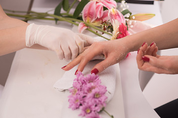 Image showing Woman hands receiving a manicure