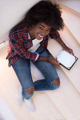 Image showing black woman using her electronic tablet