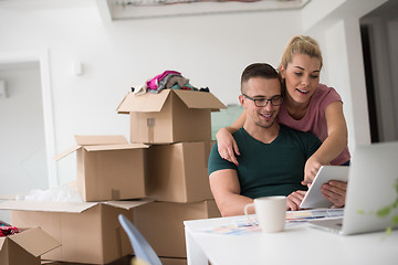 Image showing Young couple moving in a new home