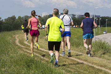 Image showing Group of young people on Outdoor cross-country running marathon