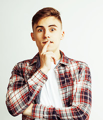 Image showing young handsome teenage hipster guy posing emotional, happy smiling against white background isolated, lifestyle people concept 