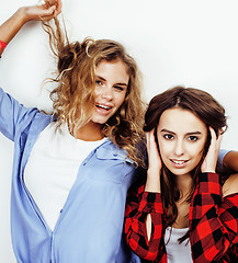 Image showing best friends teenage girls together having fun, posing emotional on white background, besties happy smiling, lifestyle people concept 