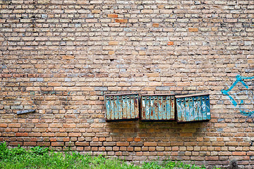 Image showing Rusty mailboxes on the brick grunge wall