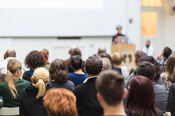 Image showing Woman giving presentation in lecture hall at university.