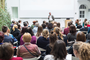 Image showing Man giving presentation in lecture hall at university.