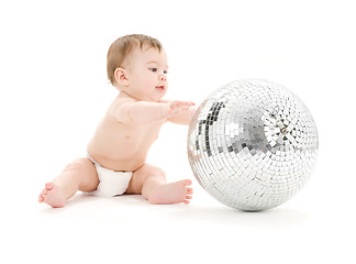 Image showing adorable baby boy with big disco ball