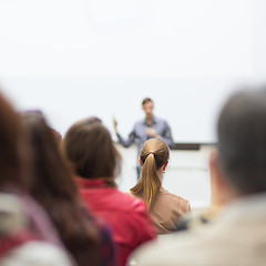 Image showing Man giving presentation in lecture hall at university.