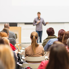 Image showing Man giving presentation in lecture hall at university.